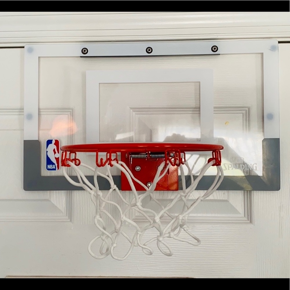 Bedroom door basketball net with ball.